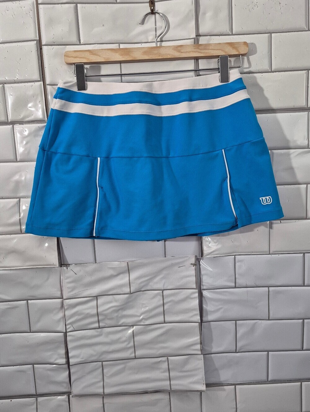 Wilson Young Women’s Tennis Skort In A Bright Turquoise Blue With White Contrast